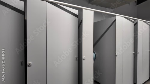 Row of Toilet Cubicles in Clean Public Restroom