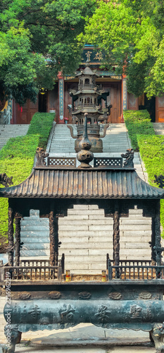 Obraz na plátně Bronze Incense Burner at a Traditional Chinese Temple with Stone Stairs and Gree