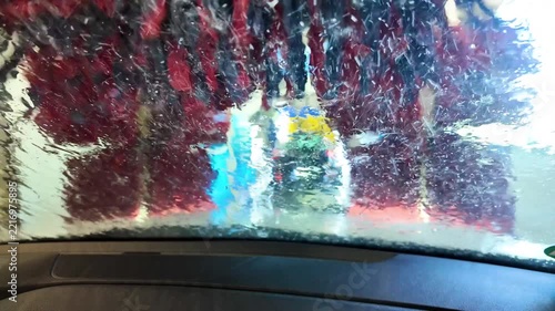 Car Surrounded by Brushes in Automated Wash Station