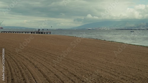 People on Wooden Pier at Izmit Bay Beach