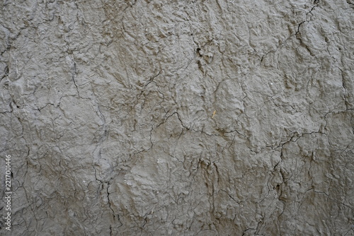 Cracked dry mud wall texture background