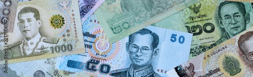 Obraz na plátně Thai baht money bills in pile on table