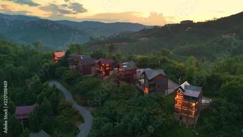 Mountain cabins and luxury lodges on wooded hillsides with breathtaking panoramic views and peaceful countryside atmosphere