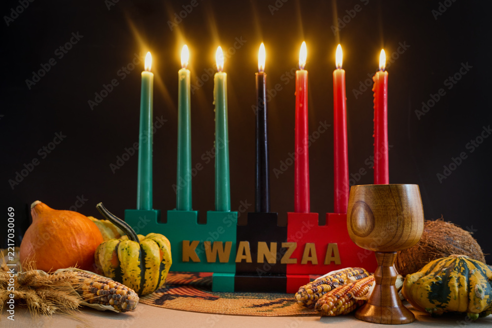 Naklejka premium Kwanzaa kinara with mishumaa saba and harvest symbols