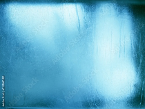 Blue frosted glass texture with light reflections