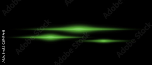 Abstract green lens flare streaks on a black background with subtle color variations