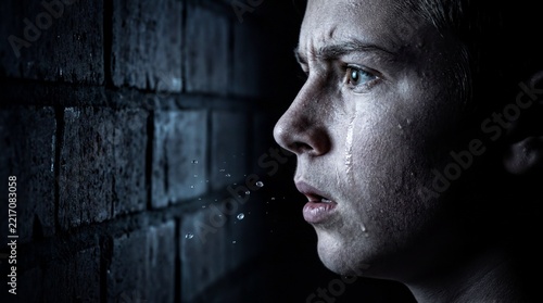 Hostile Confrontation, A teenager reacts with shock during a tense and hostile confrontation