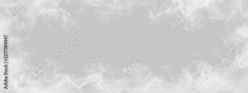 Thick swirling white smoke forms a frame on a solid black background. The dense plumes twist and curl with intricate, soft edges around an empty center space. Vapor patterns create a.