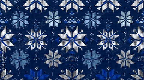 Nordic knitted snowflake pattern background for winter holiday season