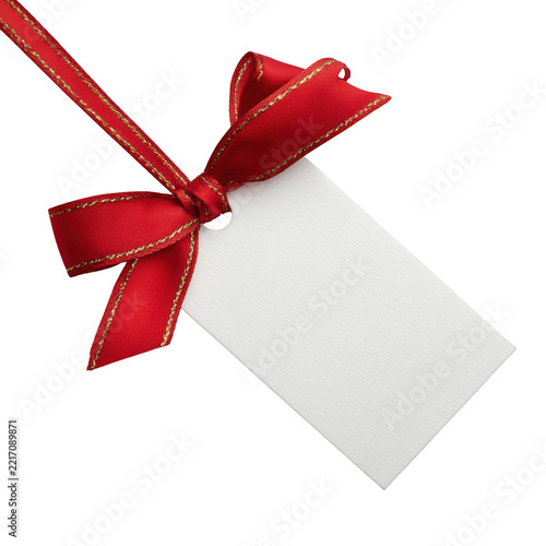 Blank white paper gift tag with red silk bow and ribbon isolated on transparent background for retail product labeling.