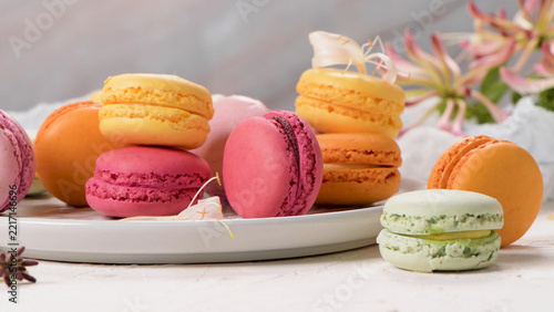 Assortment of Colorful French Macarons on a Ceramic Plate