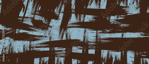 Abstract grunge dry brush strokes texture in sky blue on dark brown background