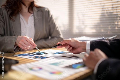 Business professionals analyzing financial data strategy during meeting