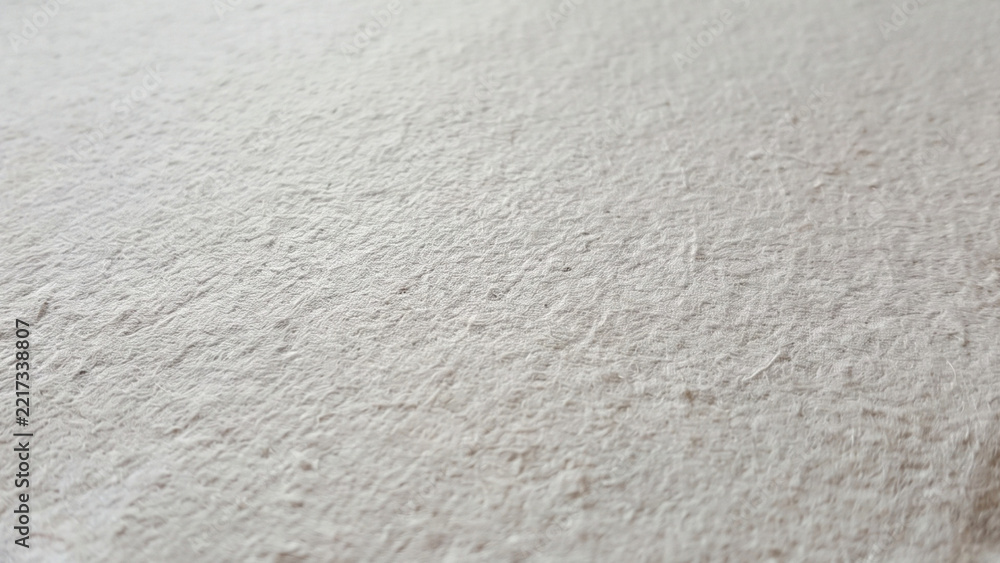 Fototapeta premium Macro close up of white handmade paper rough texture