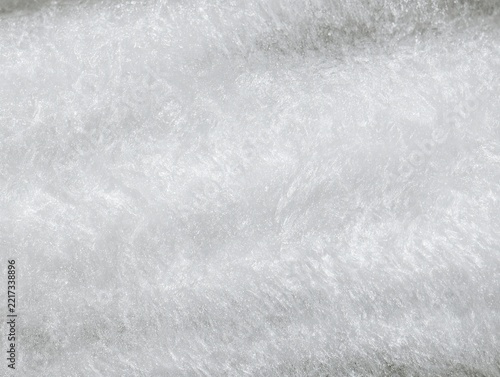 Close up of white textured surface with fibrous patterns