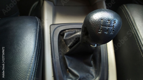 Fotografie Close up view of a car manual transmission gear shift lever and knob inside the vehicle interior, representing driving, automotive mechanics, and transport technology