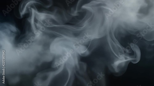 White Smoke Rising on Dark Background Motion Effect