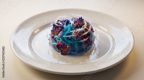 Surreal miniature alien planet served on a ceramic plate