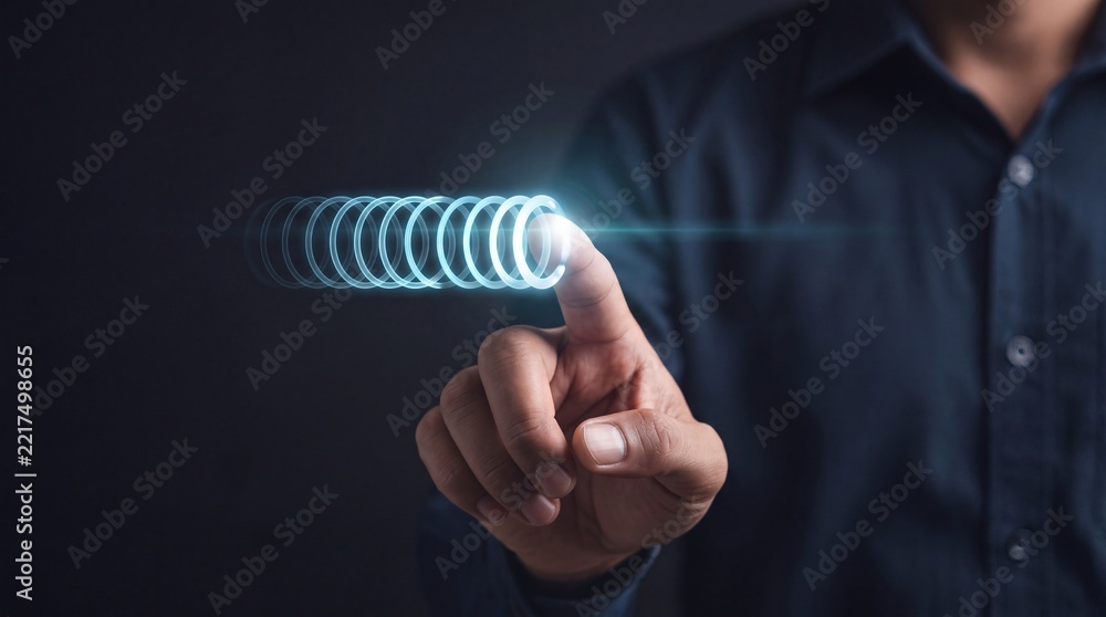 Fototapeta premium Businessman Touching Glowing Digital Circular Interface for Premium Commercial System Upgrade and Technology Innovation Concept on Dark Background