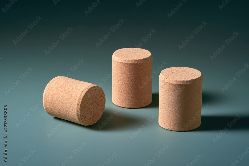 Fototapeta premium Three Corks on a Dark Teal Surface