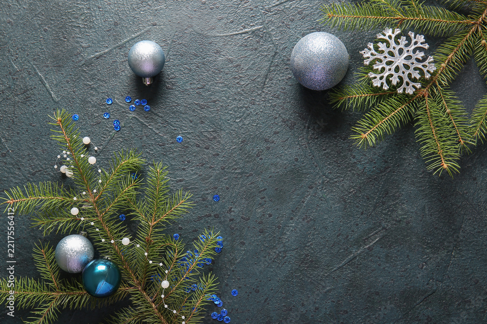 Fototapeta premium Fir branches with Christmas balls and snowflake on dark background