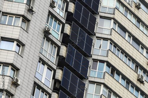 Solar panels and a battery storage system mounted on a modern apartment building in Kyiv, Ukraine, providing renewable energy and backup power for residential use.