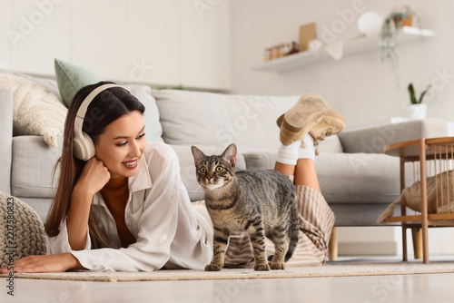 Work-life balance and mental health, young woman relaxing at home with her ca...