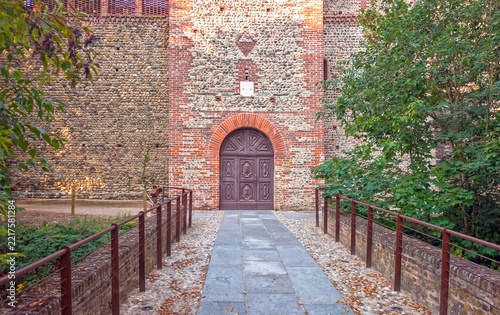 Historic Fortress Entrance and Wooden Door in Rivalta di Torino, Italy
