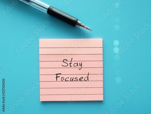 Pink note written  - Stay focused - means to keep full attention and effort on a single task or goal without letting outside things distract you