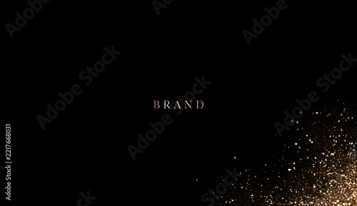 Gold sparkles bottom right on black background