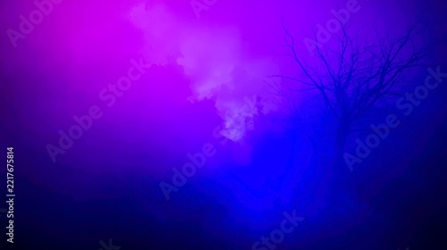 Vibrant purple and blue smoke swirls through the air