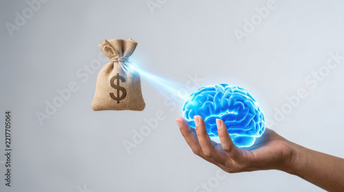 Digital healthcare innovation drives spending as hand holds glowing brain beneath money bag, symbolizing investment in medical technology