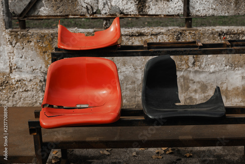 Broken Plastic Stadium Seats on Empty Stands – Vandalism, Neglect and Damaged Sports Arena Concept