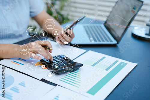 Businessmen are calculating income-expenditure and analyzing real estate investment data at office, Accounting Financial and tax systems concept.