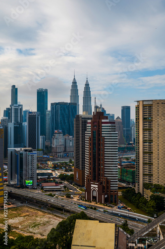 Cityscape view of Kuala Lumpur with Petronas Towers and modern architecture
