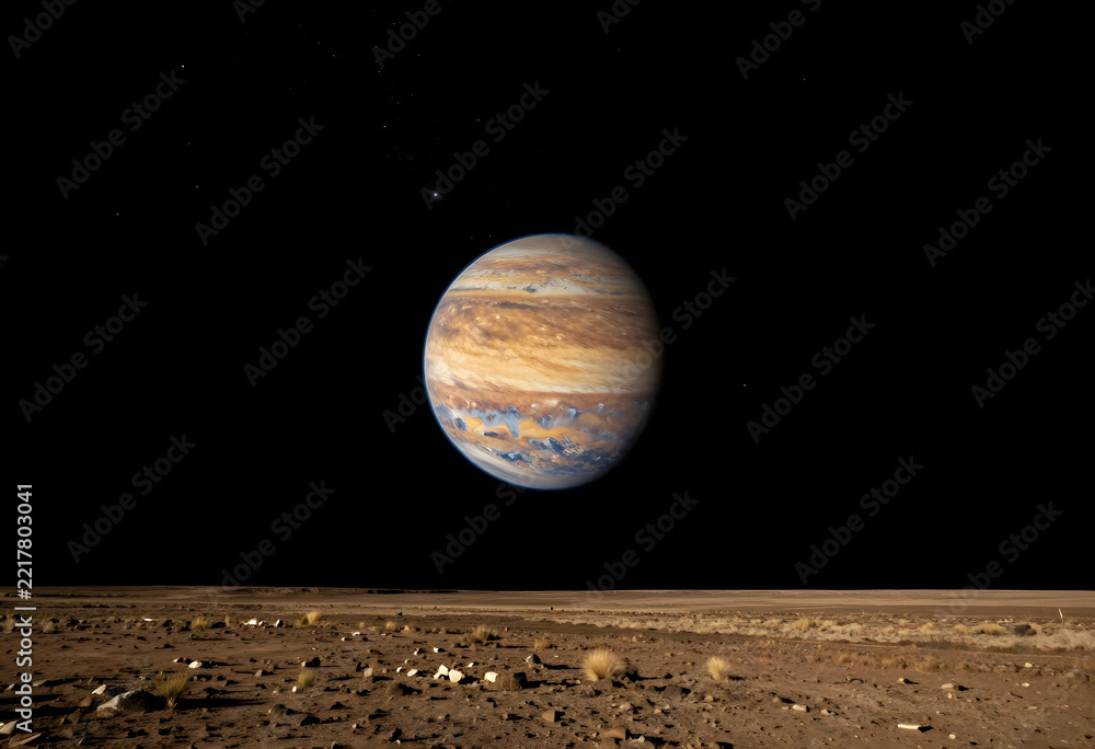 Fototapeta premium Astronomy and space exploration, giant planet Jupiter rising over a desolate alien landscape with rocky terrain and dark night sky in the galaxy