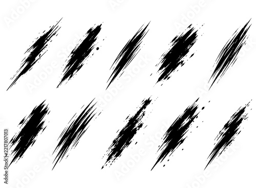 Set of diagonal black dry brush marks and slashes