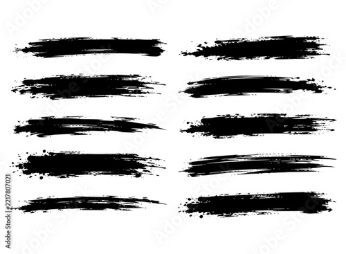 Set of eight horizontal black grunge brush strokes