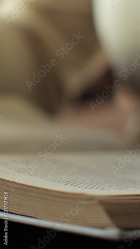 Vertical video. Female or student enjoying entertainment literature or educational textbook. Learning, studying, education, read books, stay home concept.