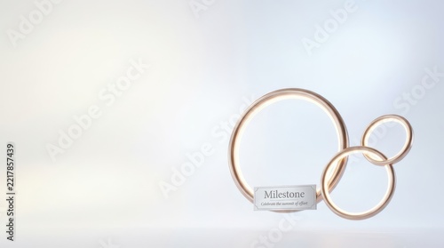 Two gold rings symbolize a milestone celebration