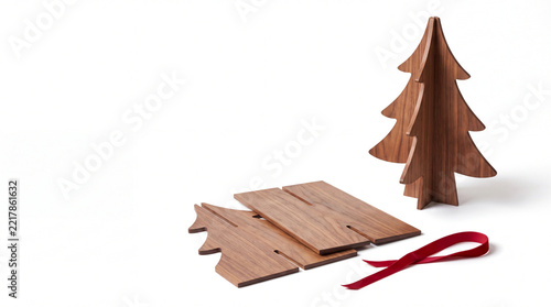 Slotted wooden Christmas tree kit isolated on white background with copy space.