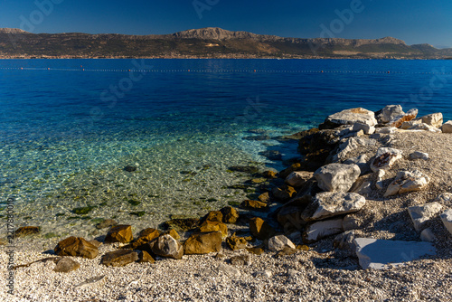 Empty Acida Beach on Ciovo Island with panoramic view of Kaštela, Croatia