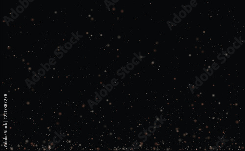 Rose gold and white bokeh particles with tiny glitter dust rising on black background