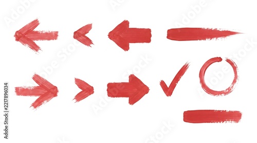 Collection of vibrant red hand drawn arrows and doodle style checkmarks on white background