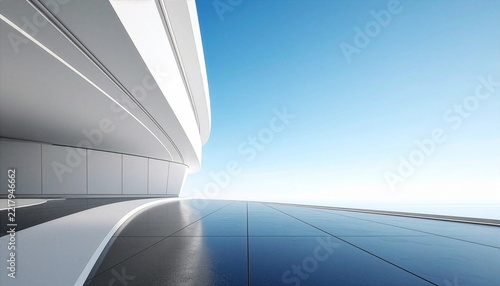 Futuristic architectural design with a sleek curved white building exterior and a polished dark reflective floor against a clear blue sky