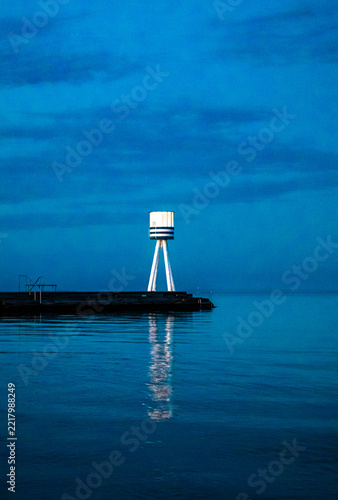 Blue hour beacon sea reflection