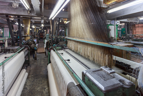 An old weaving loom still works in the mill.