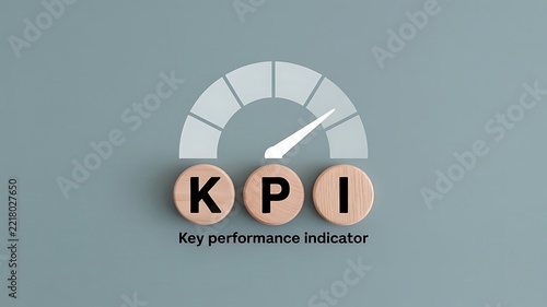 Conceptual illustration of key performance indicators with a gauge meter and wooden blocks for business growth and success measurement