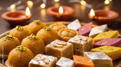 Traditional Indian sweets for Diwali festival celebration including laddu and barfi on plate