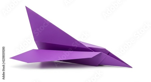 Purple geometric paper airplane flying in air